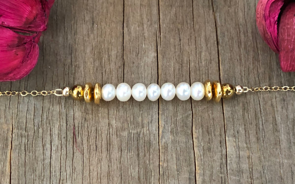 White pearl gold chain bracelet