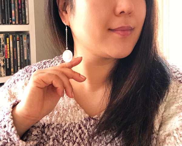 White glass coin earrings